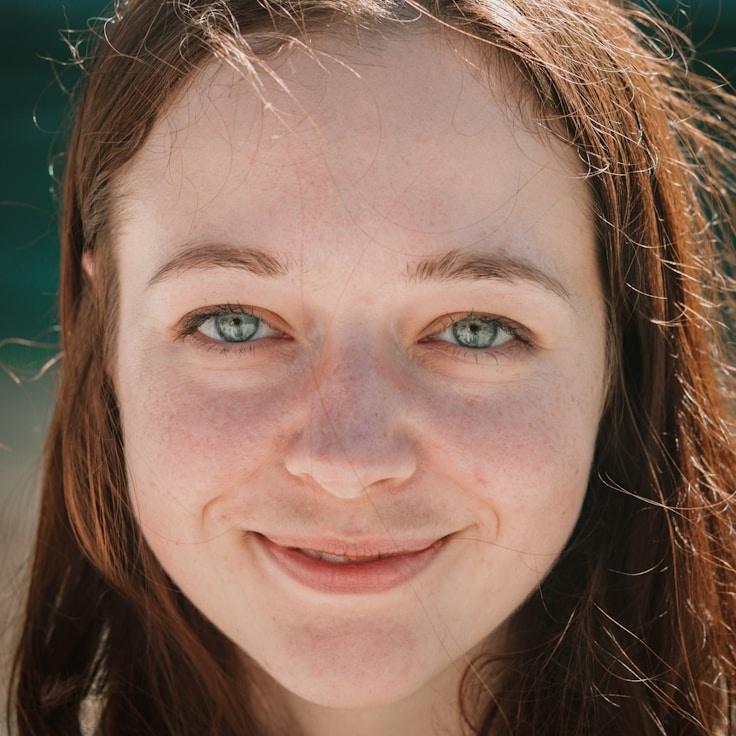 Alex Morgan, Lead Design Curator at Brook Harbor Studio, reviewing corporate floral arrangements